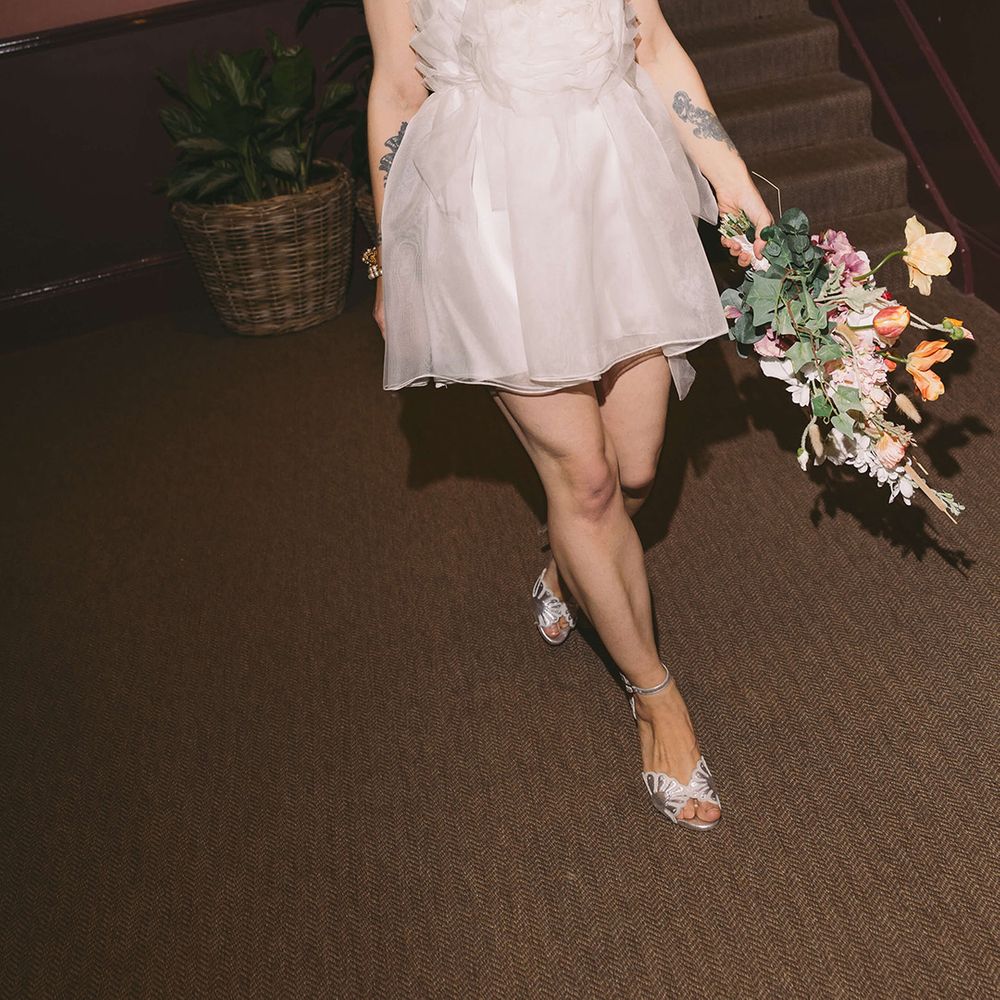 bride-in-bespoke-short-wedding-reception-dress