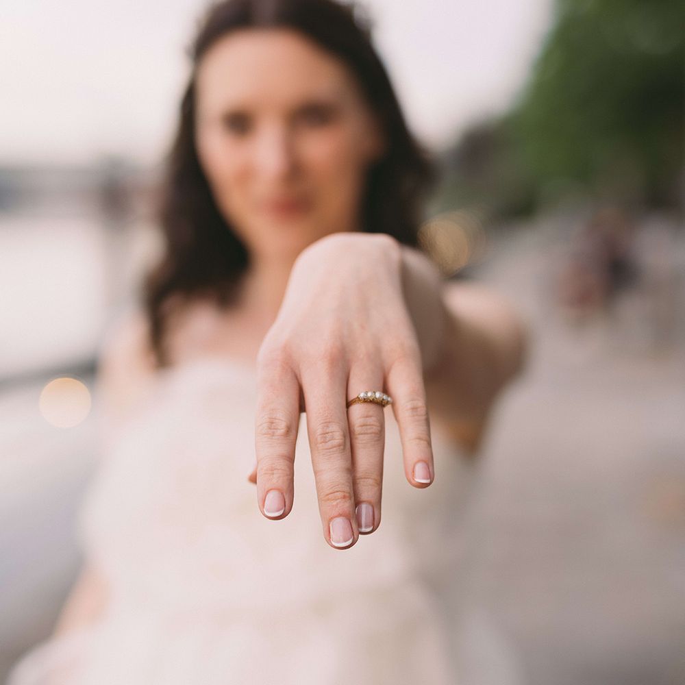 bride-showing-off-pearl-wedding-ring
