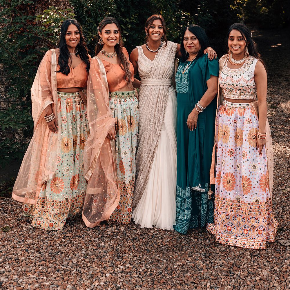 bridesmaids-and-bride-in-sparkly-beaded-outfits.