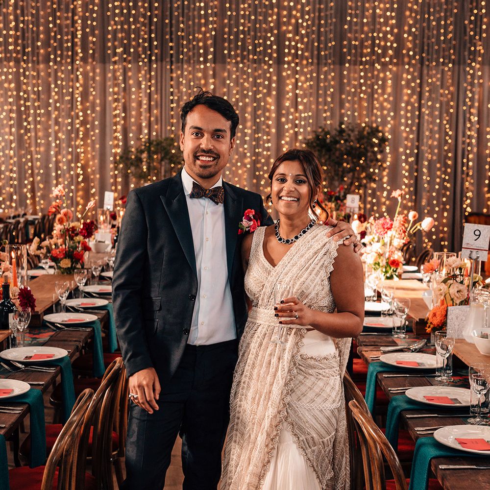 groom-in-black-tux-with-bride-in-gold-dress