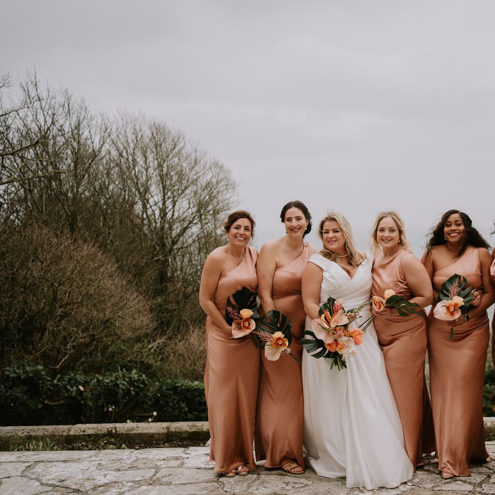 bridal-party-in-rose-gold-one-shoulder-dresses