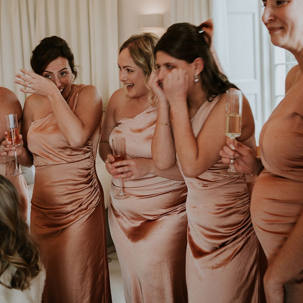 bridesmaids-in-matching-satin-one-shoulder-dresses