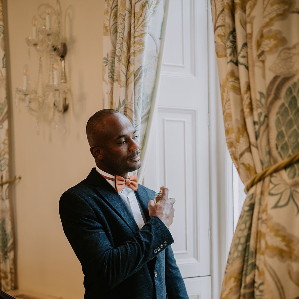 groom-sprays-cologne