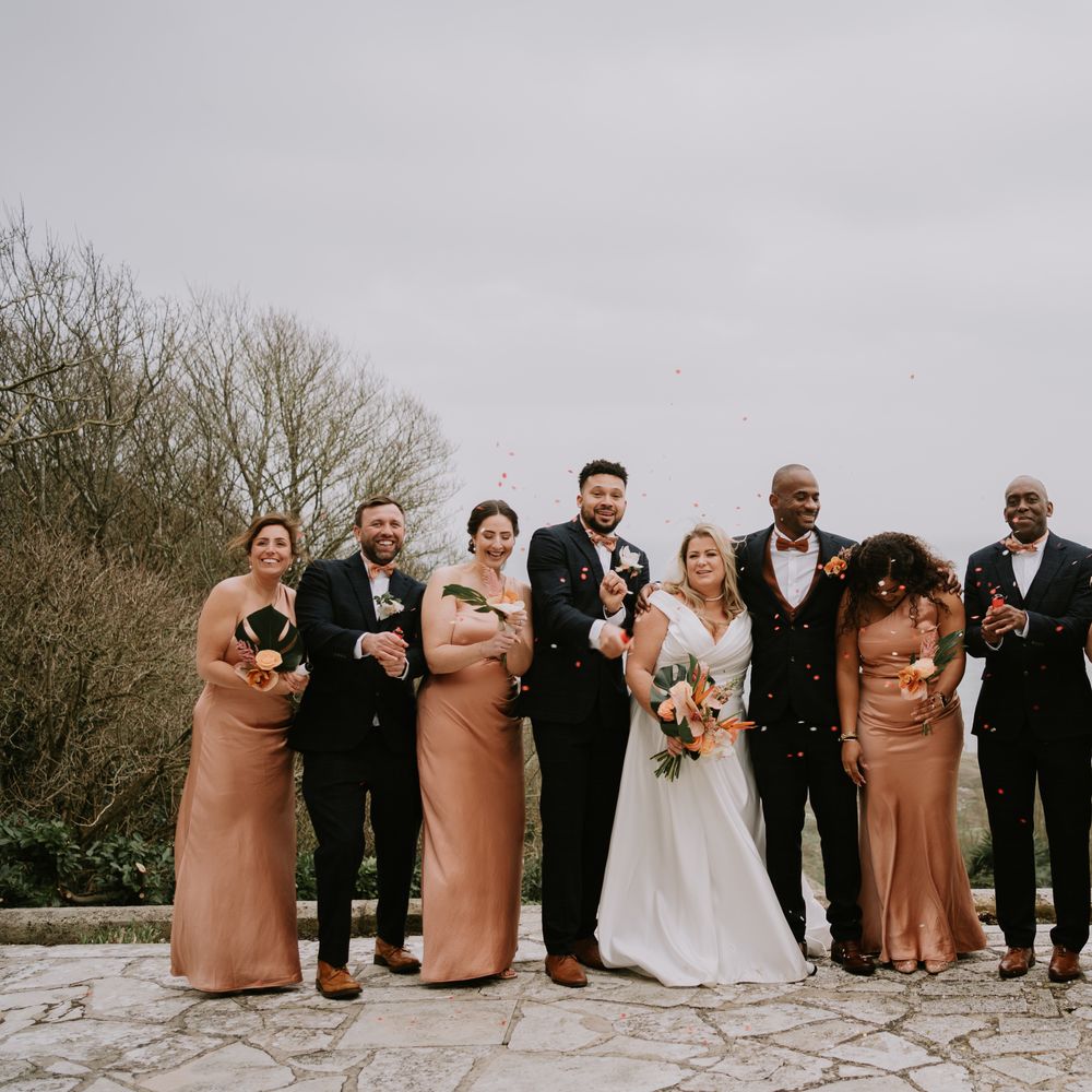 wedding-party-wearing-one-shoulder-satin-bridesmaid-dresses