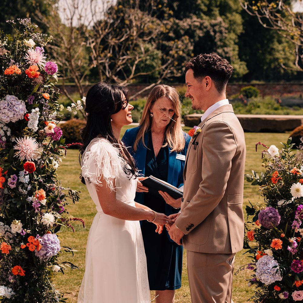 bride-and-groom-exchange-vows-at-their-wedding-ceremony