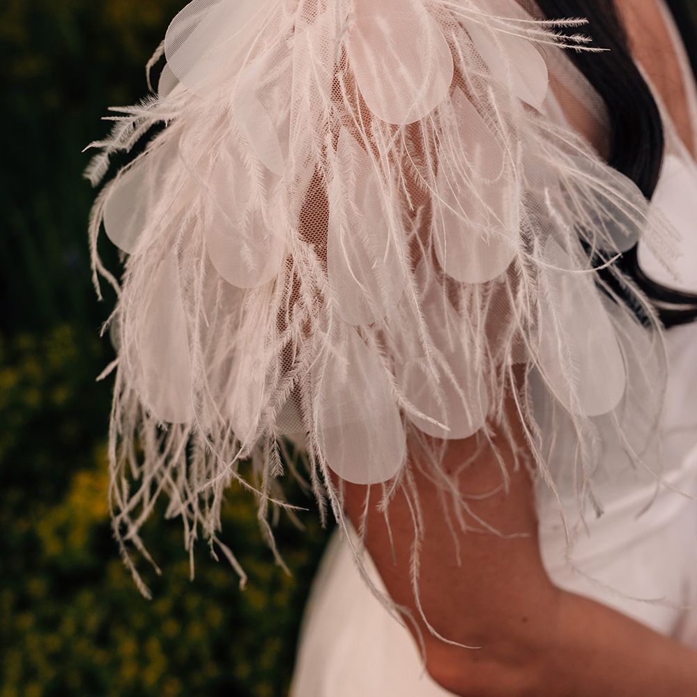 bride-wears-feather-wedding-dress