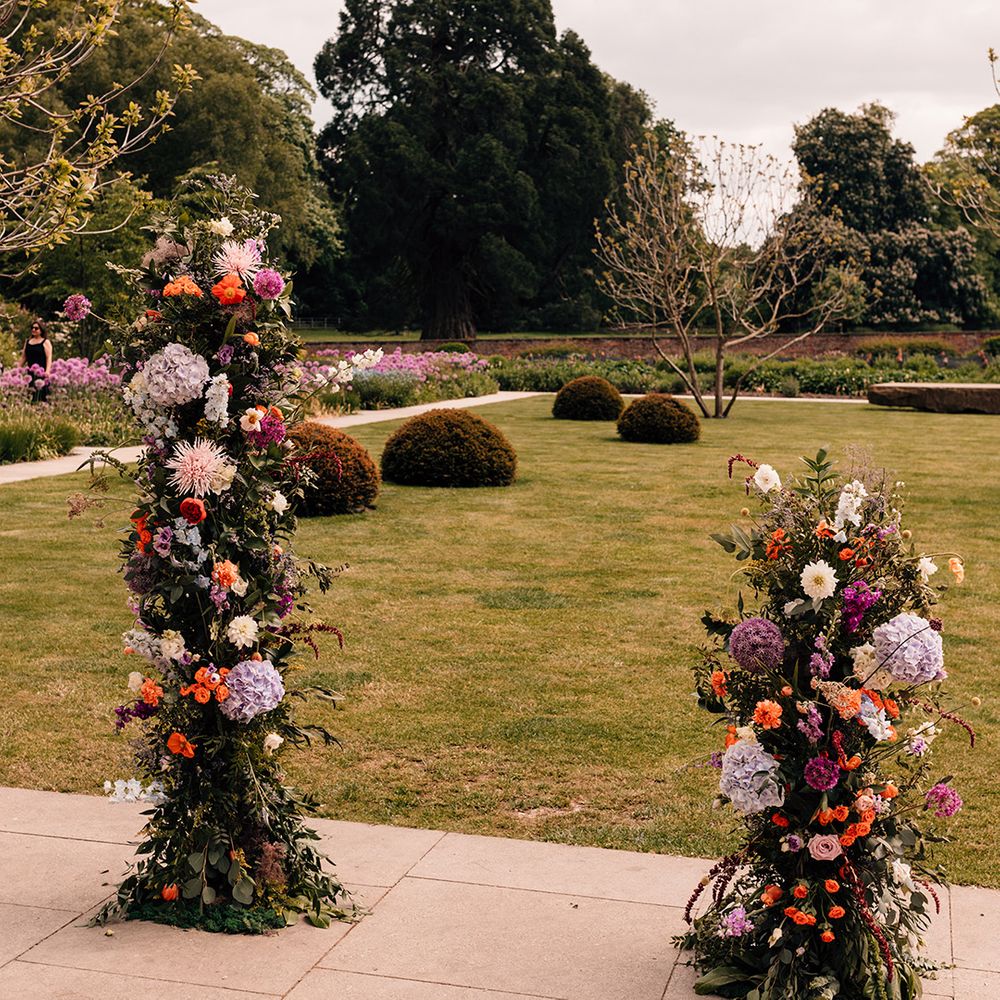 bright-colourful-wedding-flower-column-decor