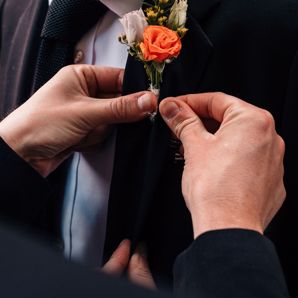 buttonhole-gets-fixed-to-suit-jacket