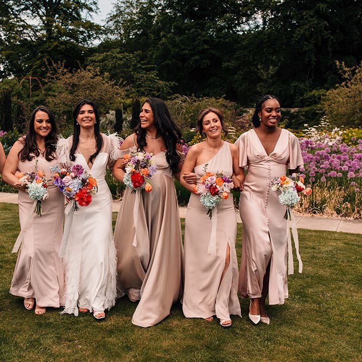champagne-gold-bridesmaid-dresses-for-bridal-party-holding-colourful-bouquets
