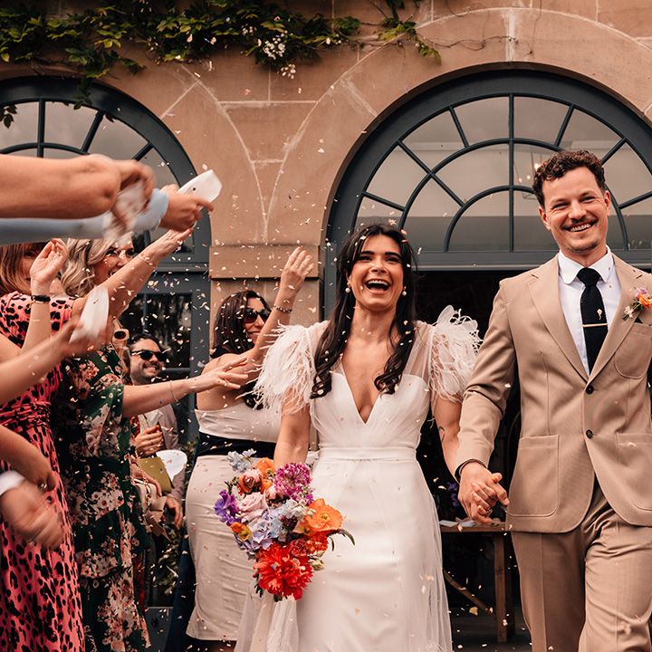 confetti-moment-for-the-bride-and-groom-at-middleton-lodge