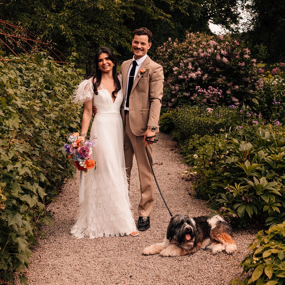 couple-portrait-of-bride-and-groom-with-their-pet-dog