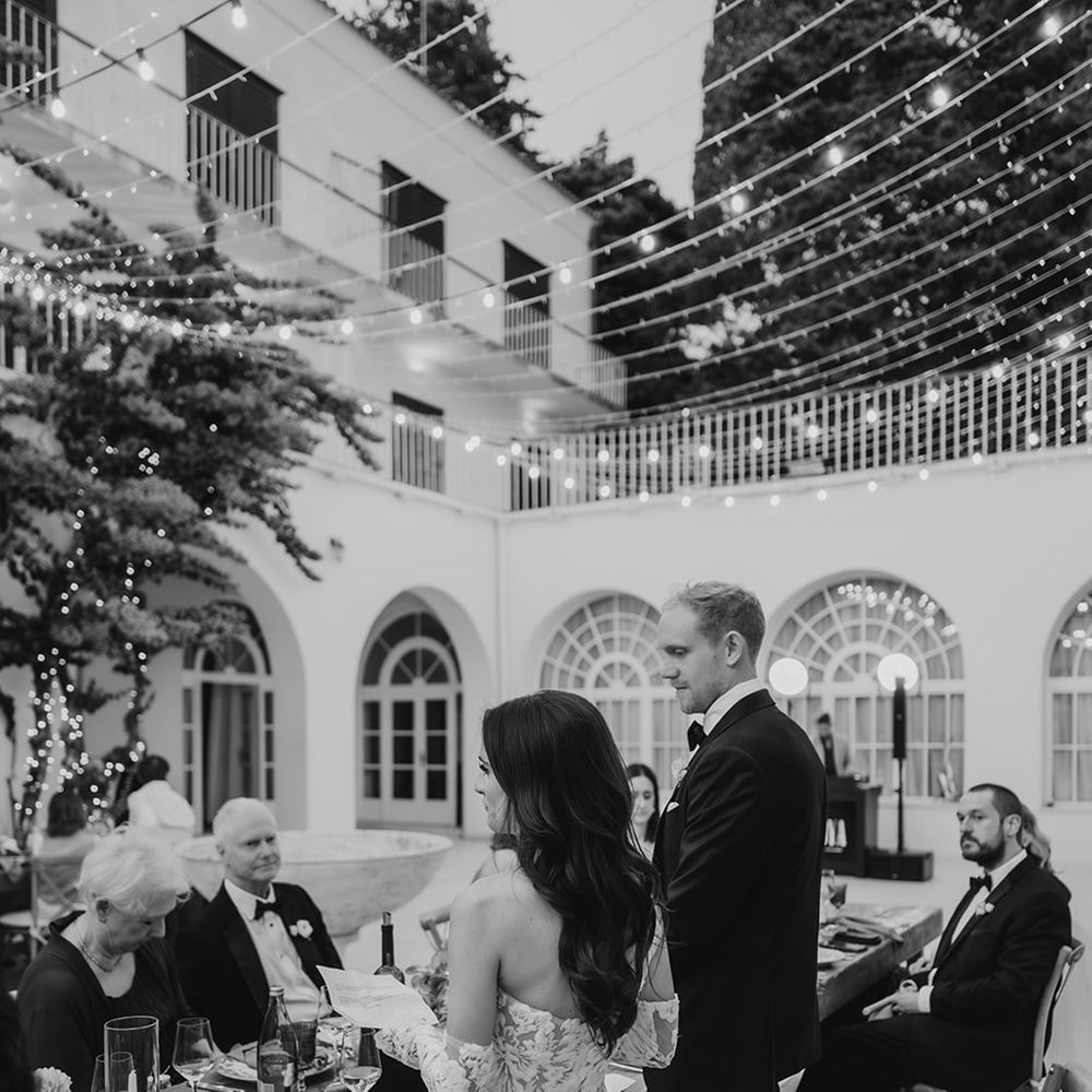 bride-and-groom-stand-for-wedding-speeches