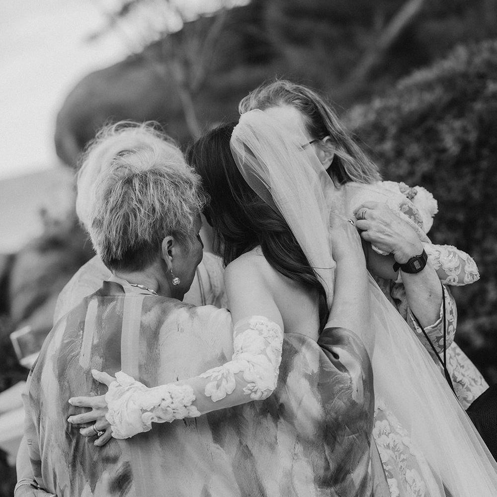 bride-embraces-wedding-guests