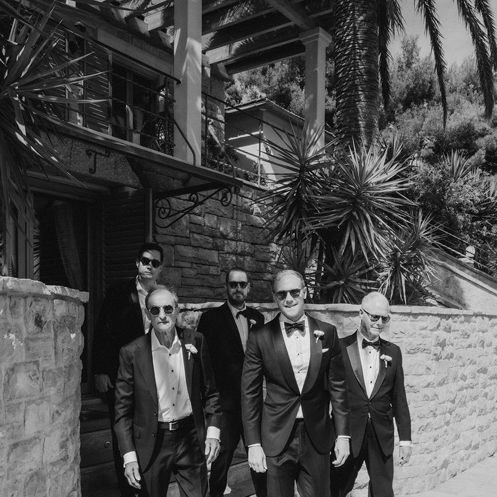 groom-and-groomsmen-wearing-black-tuxedos