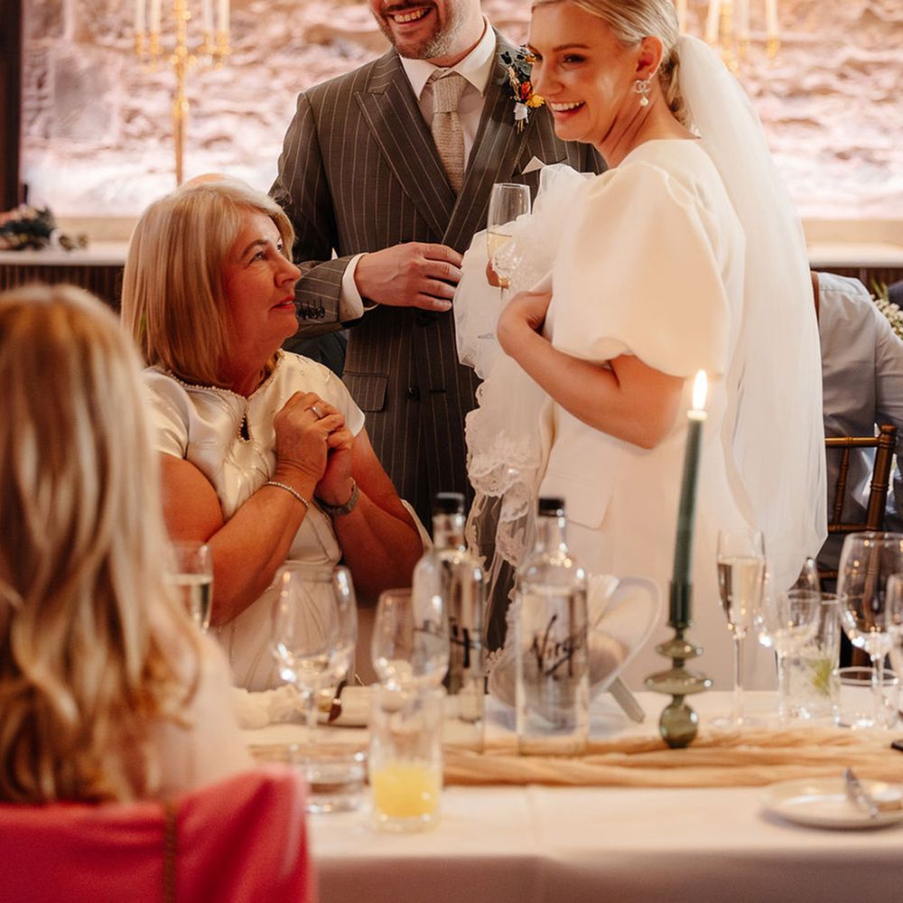 bride-and-groom-stand-for-joint-wedding-speech
