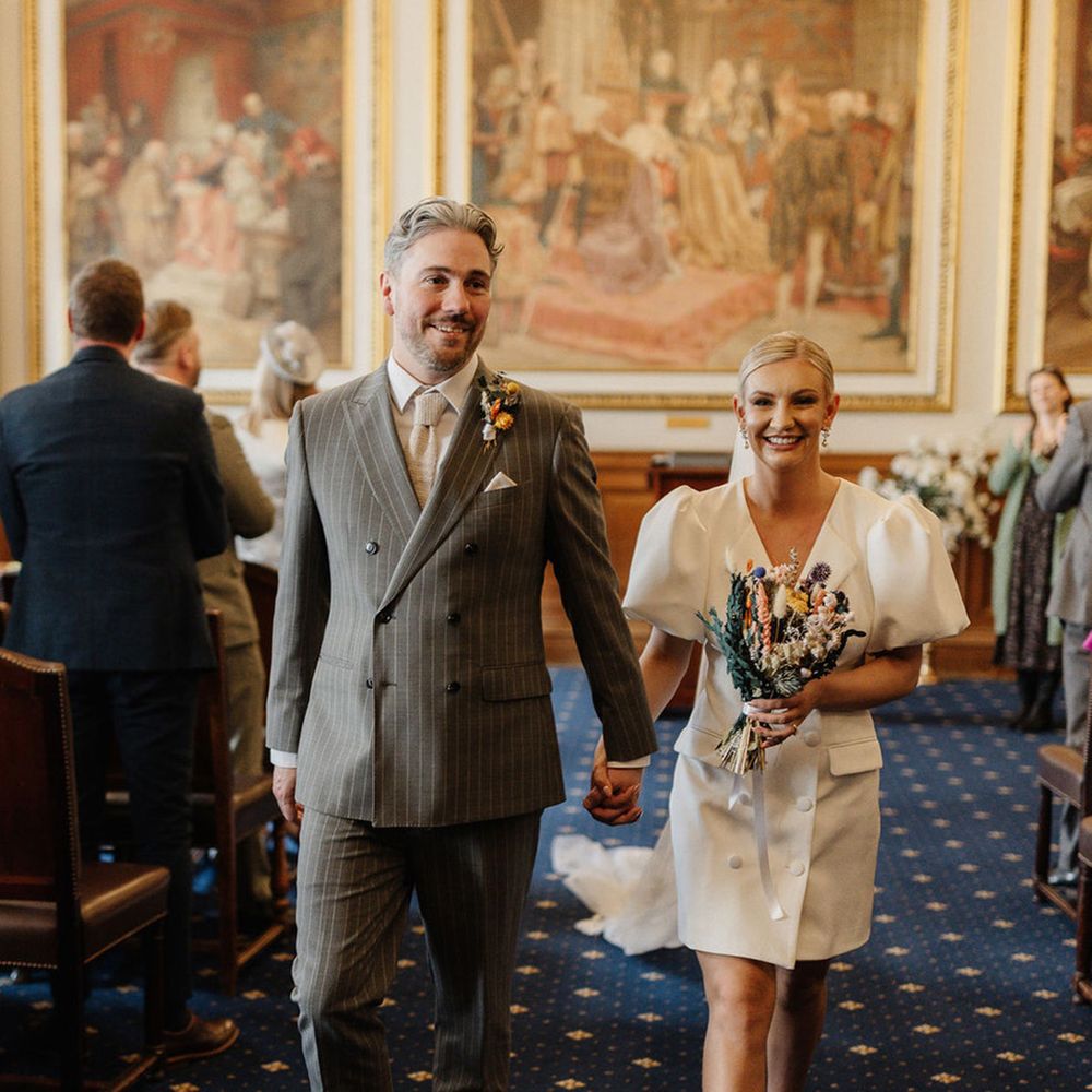 couple-walk-back-down-the-aisle-as-a-married-couple