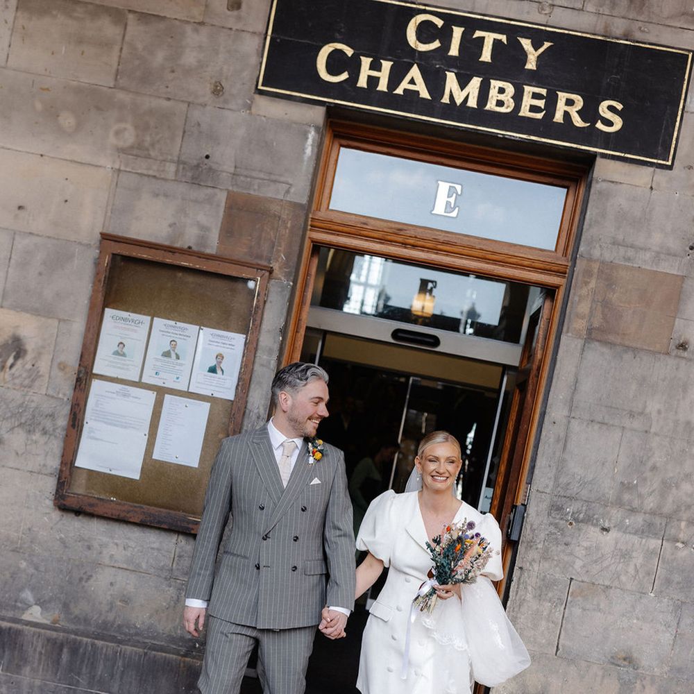 double-breasted-grey-wedding-suit-for-groom-with-bride-in-short-wedding-dress