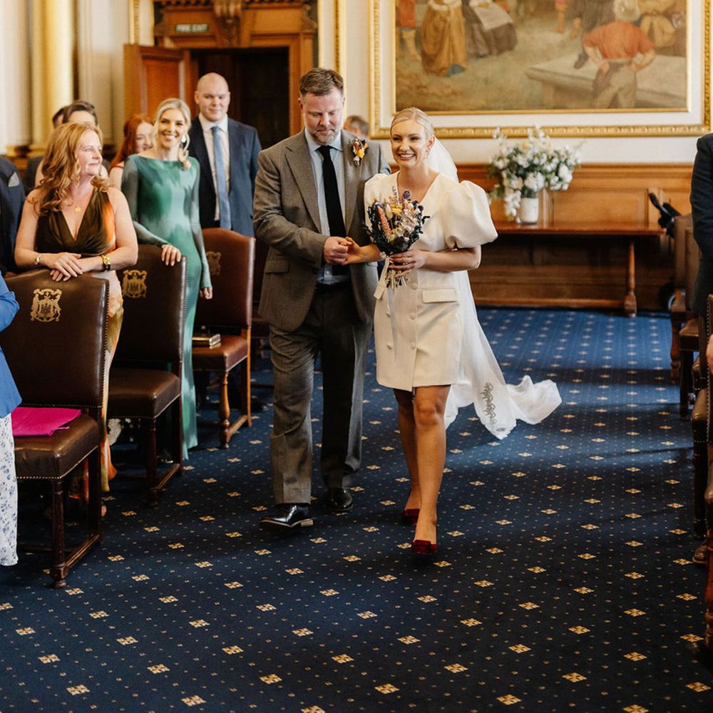 father-of-the-bride-walks-bride-down-the-aisle-at-city-hall-wedding