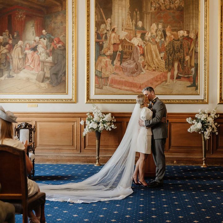 first-kiss-as-married-couple-at-registry-office-wedding