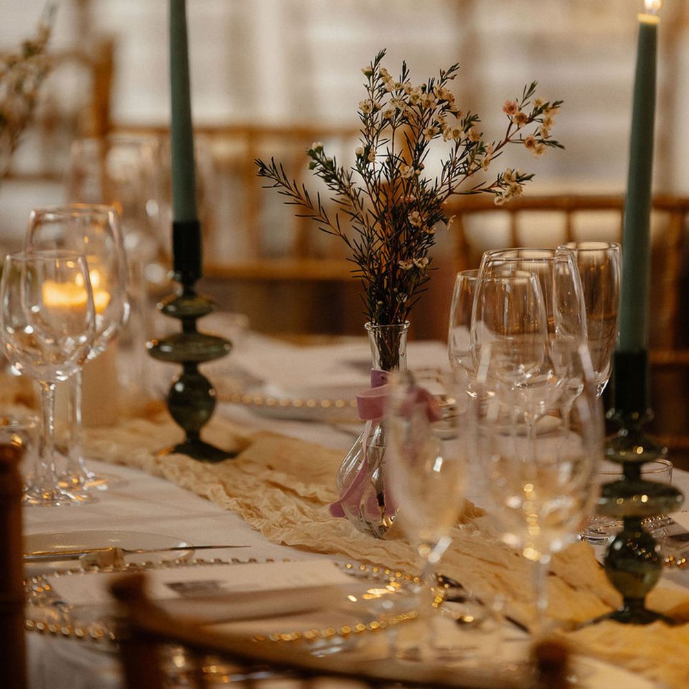 green-taper-candles-on-wooden-tables