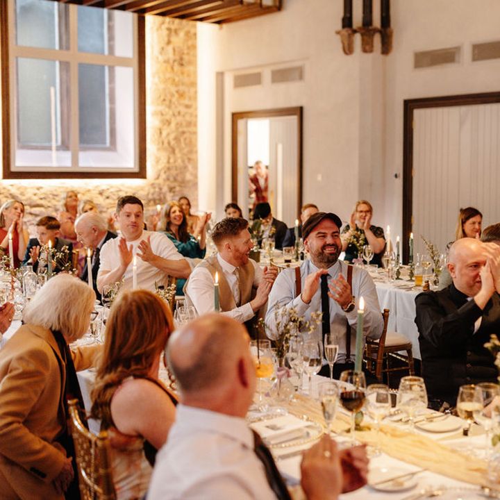 wedding-guests-raise-a-toast-during-wedding-speech