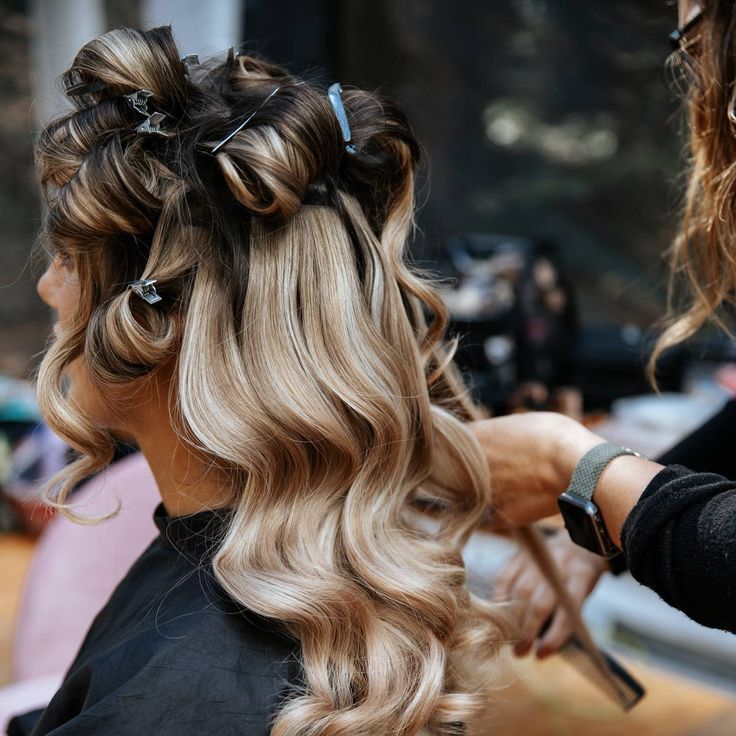 Bride With Blonde Hair Getting Hair Curled For Wedding Day