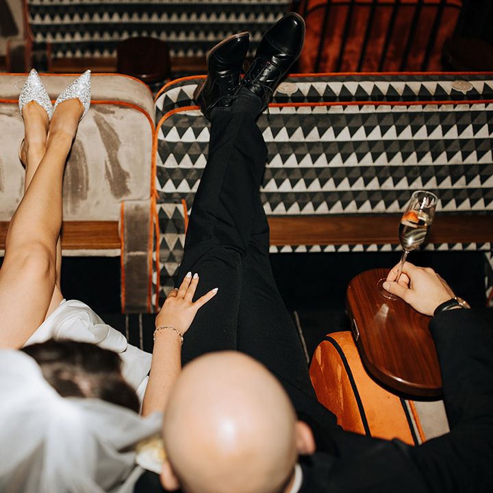 ride-and-groom-at-cinema-for-fun-couple-portrait-with-peach-bouquet