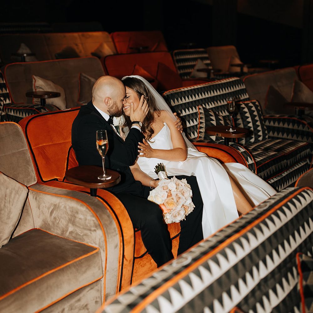 bride-and-groom-kissing-in-the-cinema-for-couple-portrait-session