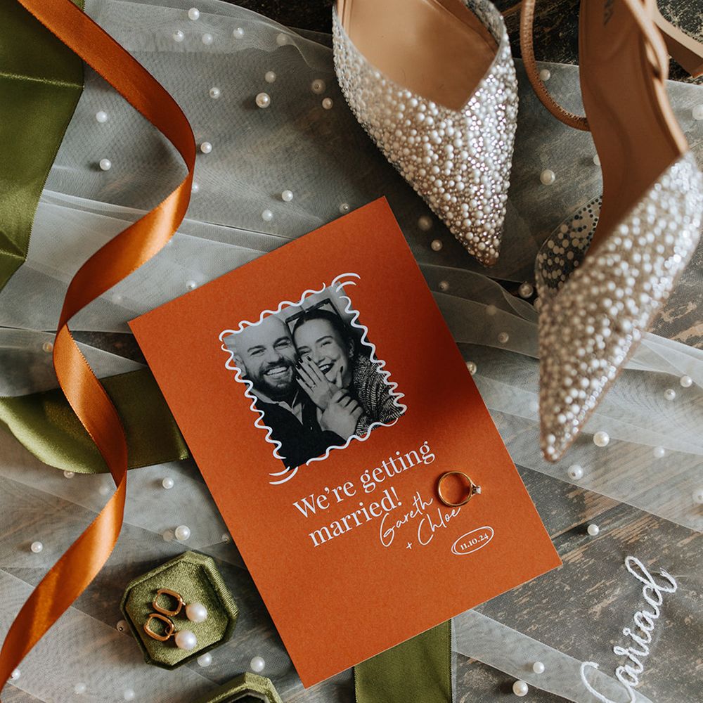 orange-wedding-stationery-with-pearl-veil-and-shoes-with-green-ring-box