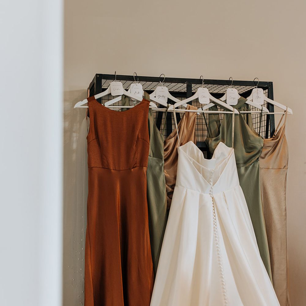 rail-with-bride-and-bridesmaid-dresses