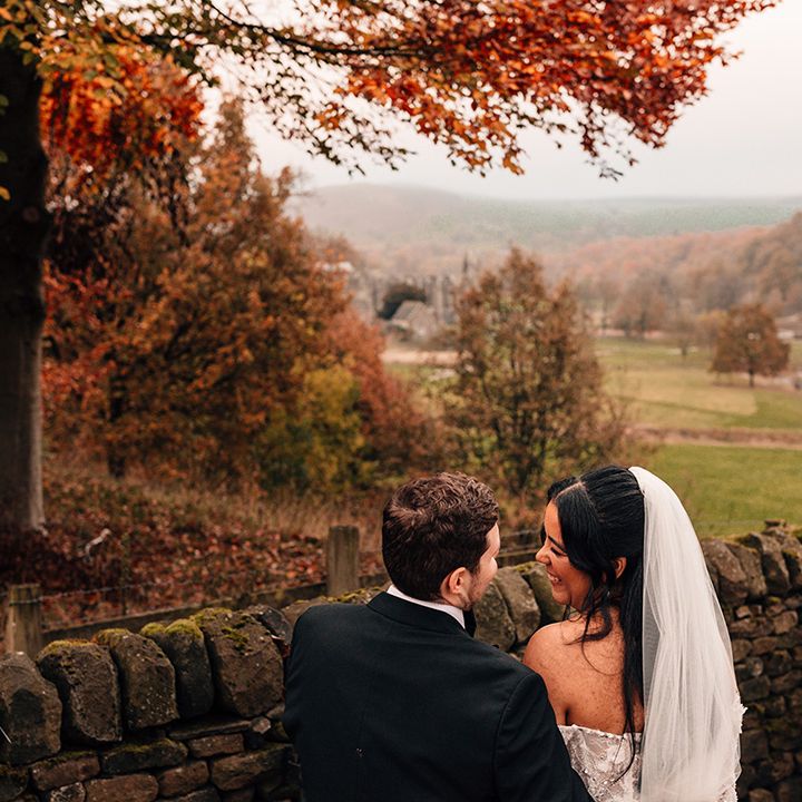 couple-gazes-into-each-others-eyes-for-autumn-wedding