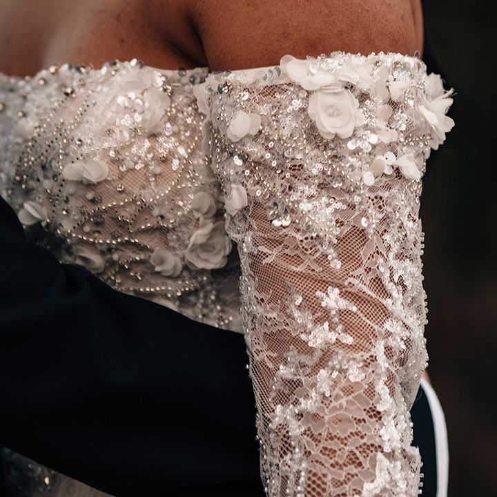 embellishments-and-details-on-brides-off-the-shoulder-wedding-dress