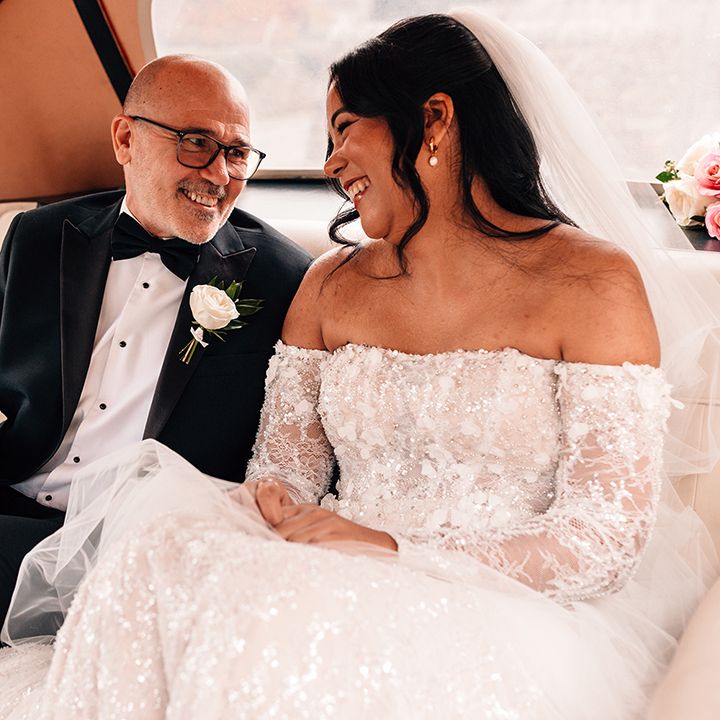father-of-the-bride-and-bride-riding-in-wedding-car.