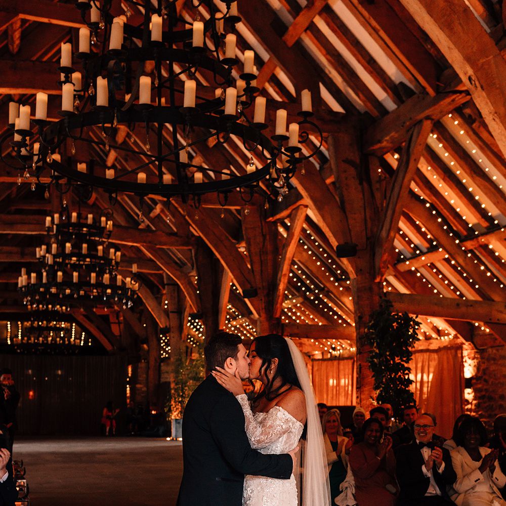 first-kiss-moment-at-tithe-barn-wedding