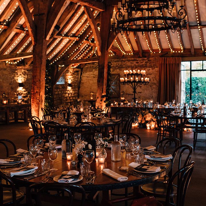 tithe-barn-wedding-breakfast-with-cosy-lighting
