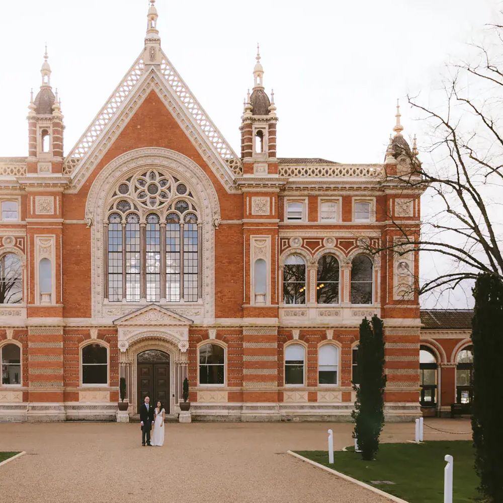 Couple stood in front of Barry Buildings at sustainable wedding venue, Dulwich College