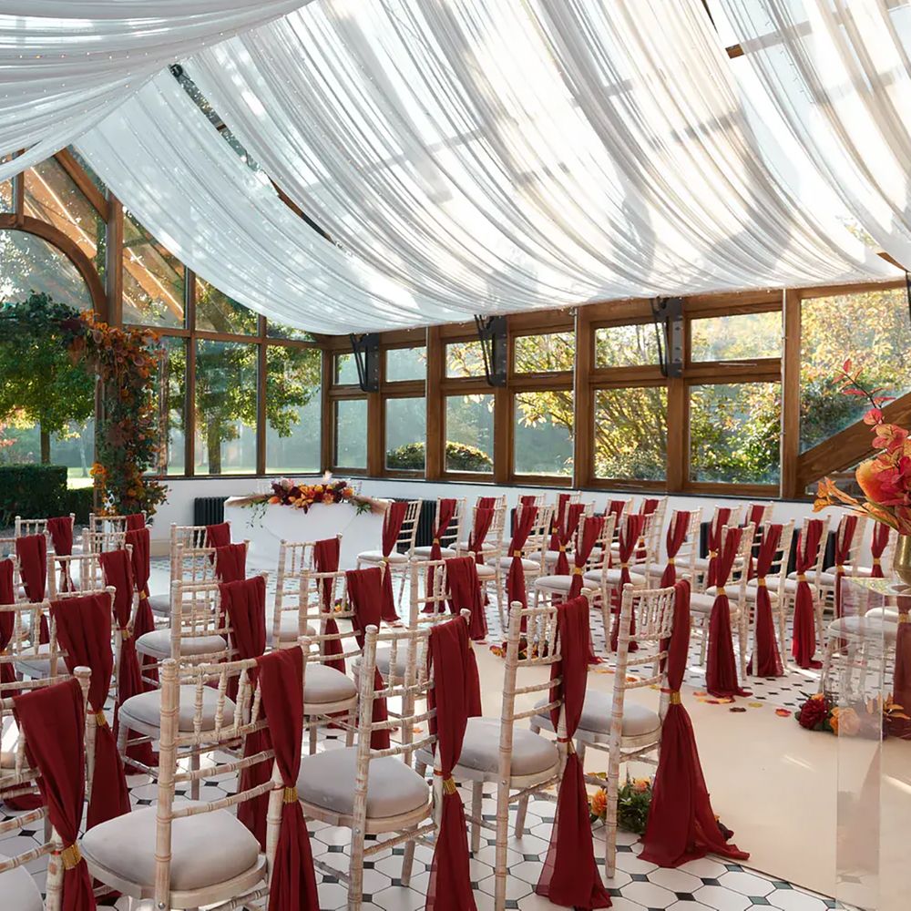 Ceremony in the summer house at Hanbury Manor, sustainable wedding venue
