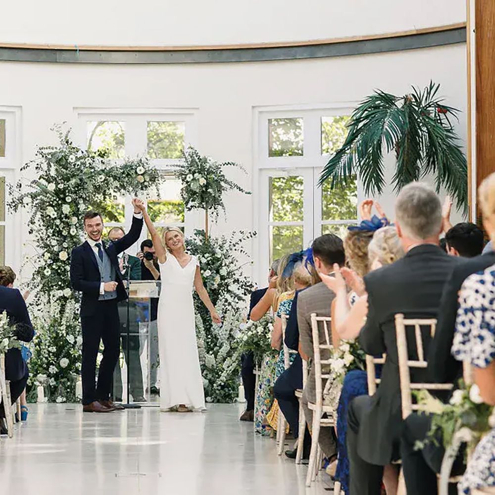 Couple's wedding ceremony at The Hurlingham Club, sustainable wedding venue