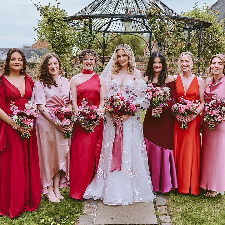 bridesmaids-in-mismatched-pink-red-and-orange-bridesmaid-dresses