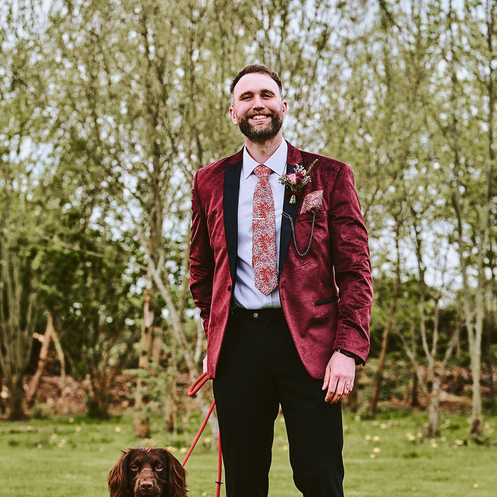 groom-matches-his-pet-dog-in-red-wedding-suit-and-dog-outfit