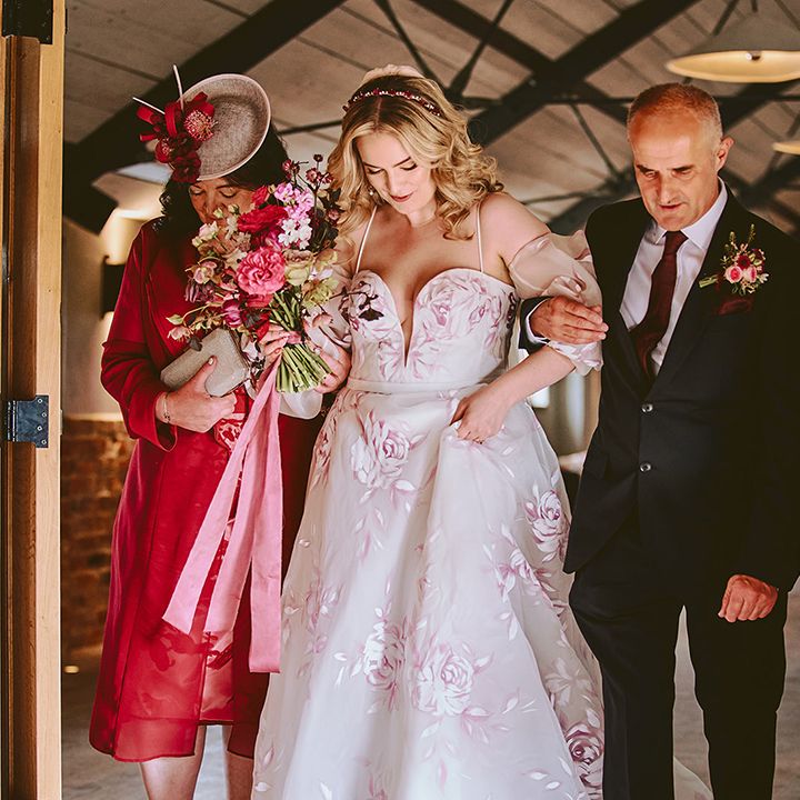 mother-and-father-of-the-bride-walk-bride-down-the-aisle