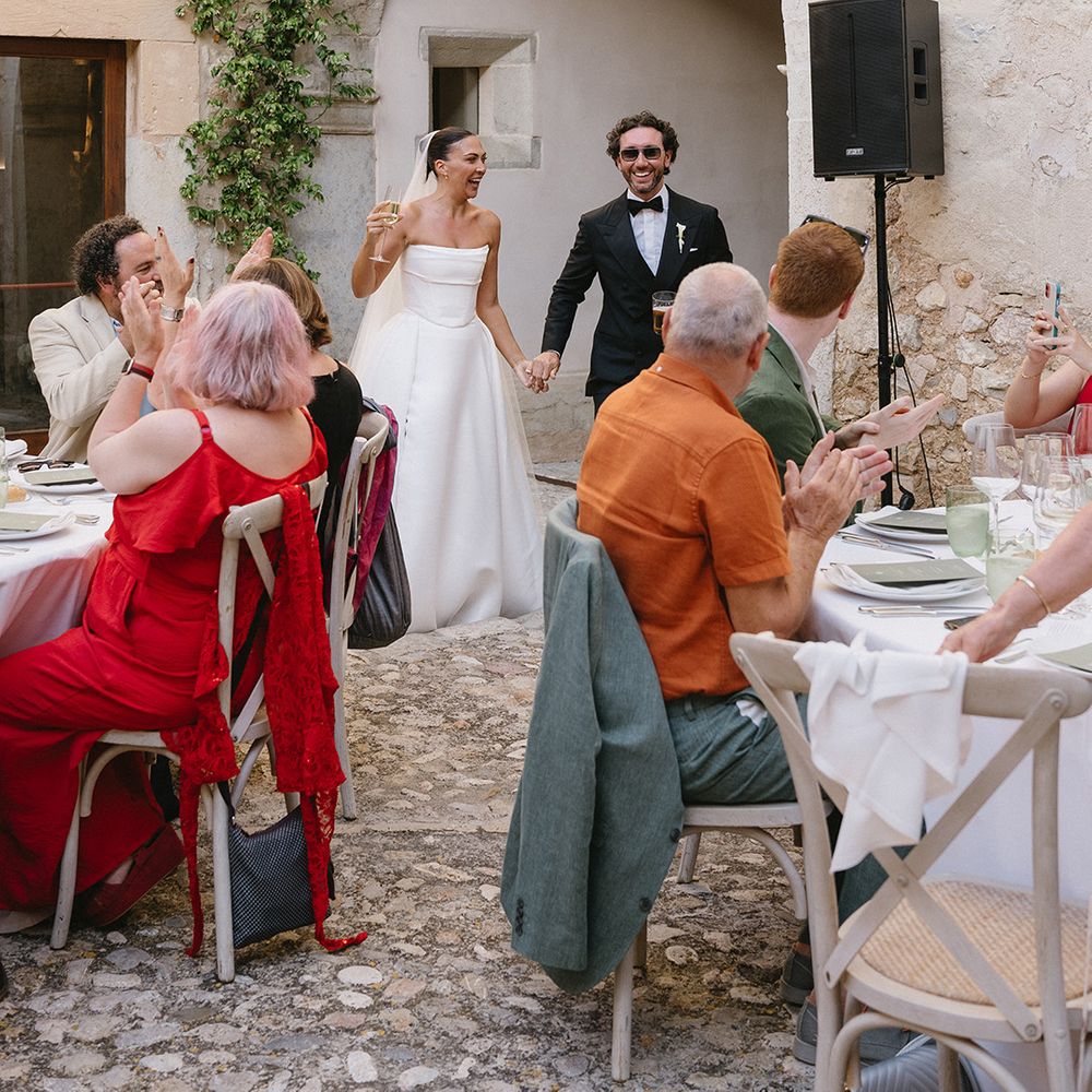couple-make-their-wedding-breakfast-entrance