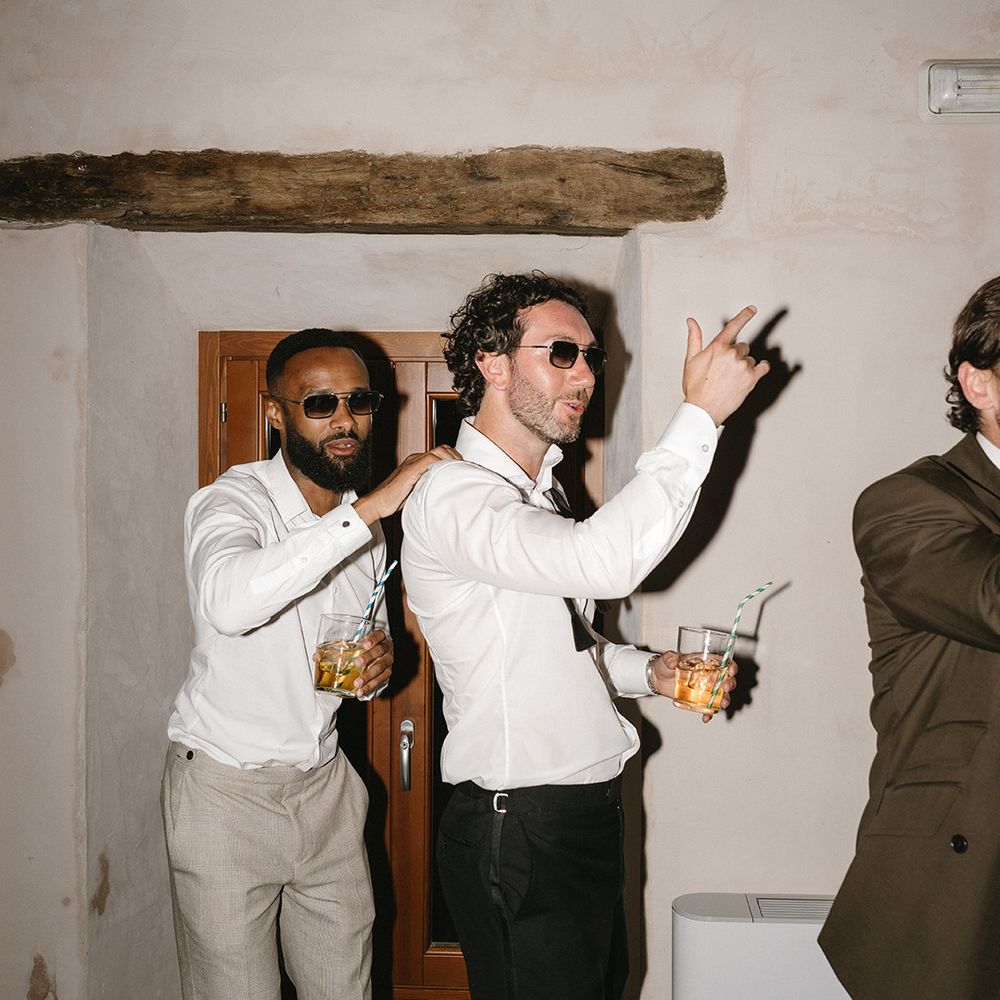 groom-dances-at-reception-with-wedding-guest