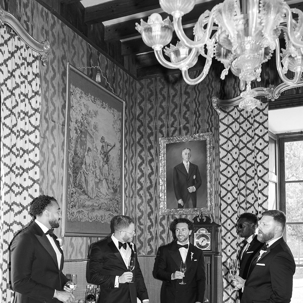 groomsmen-in-black-tuxedos-drinking-alcohol