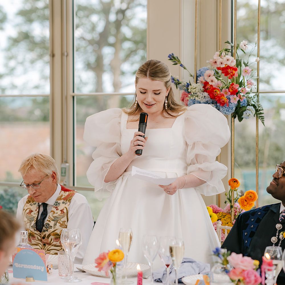 bride-in-sheer-puff-sleeve-wedding-dress-reading-speech