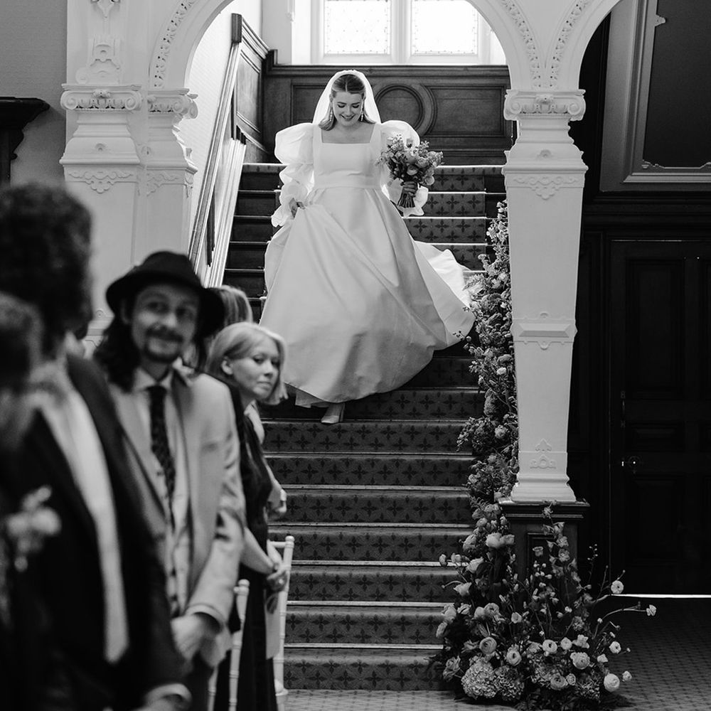 bride-walking-downstairs-into-wedding-ceremony