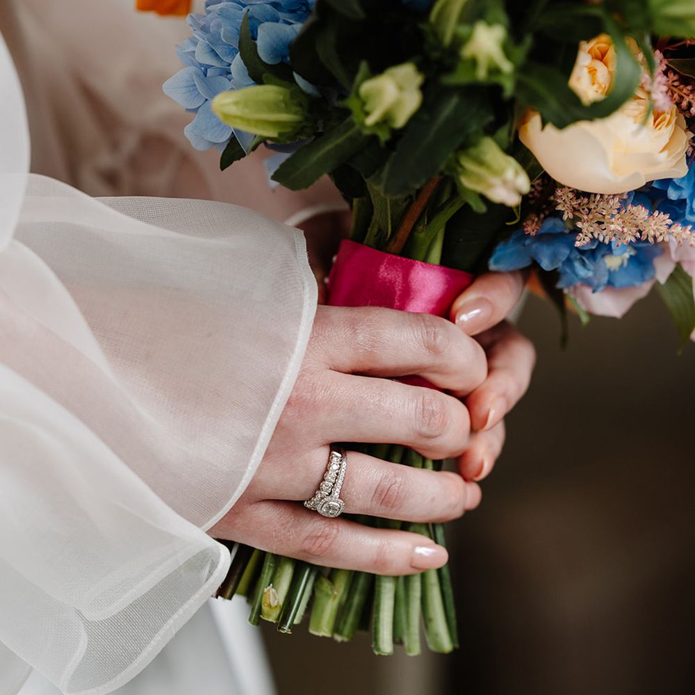 bride-wearing-diamond-wedding-band-and-engagement-ring