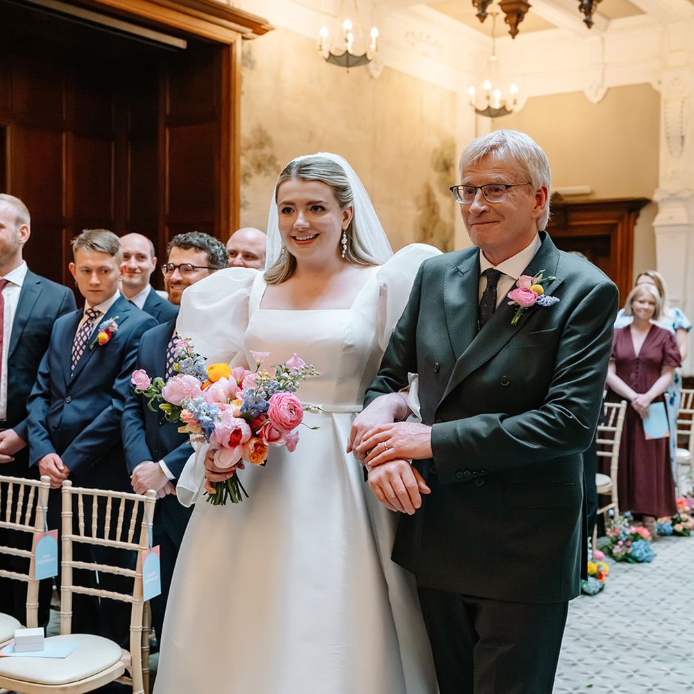 father-of-the-bride-in-green-suit-walking-bride-down-the-aisle
