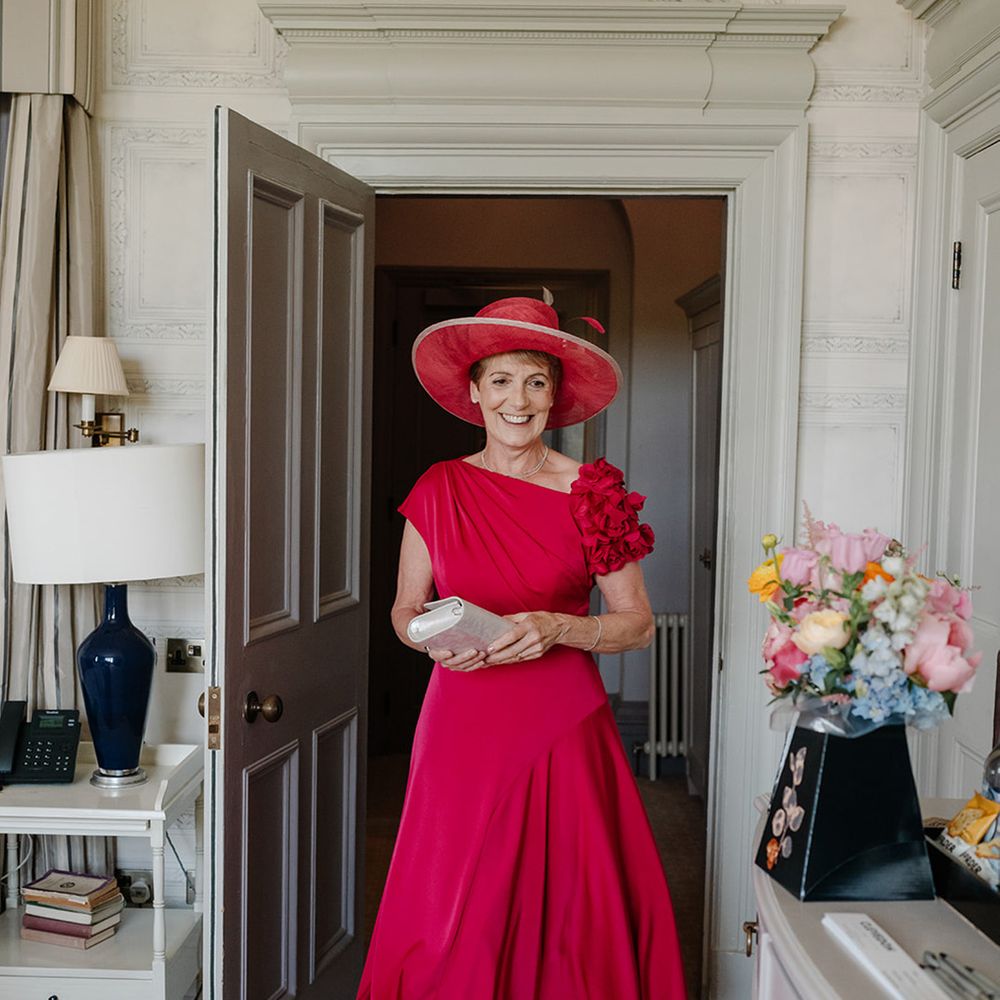 mother-of-the-bride-in-red-dress-with-red-hat
