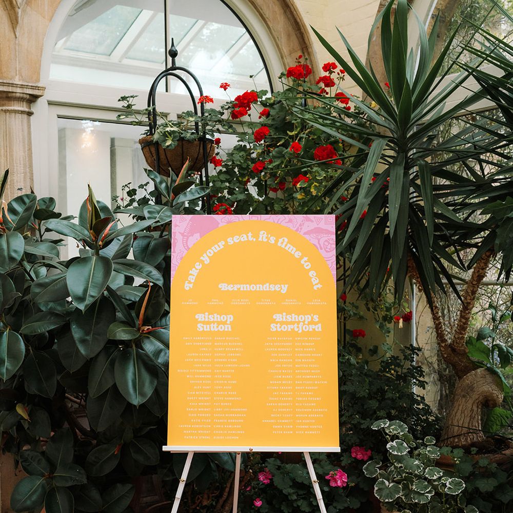 pink-and-orange-wedding-seating-chart-signage